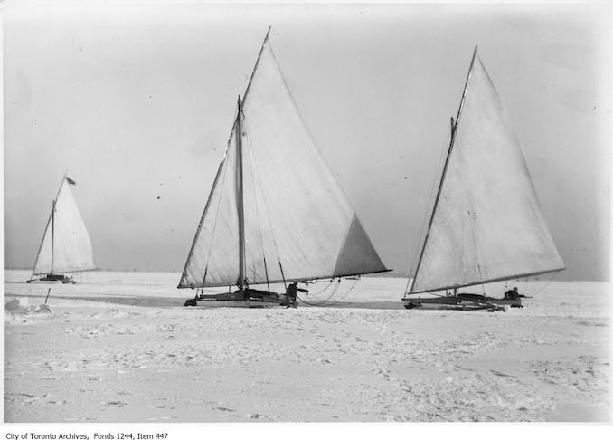 Toronto Winter Photographs Iceboats, Toronto Bay. - [between 1906 and 1910] - photograph of three iceboats racing a car (not shown) on frozen Toronto Bay.