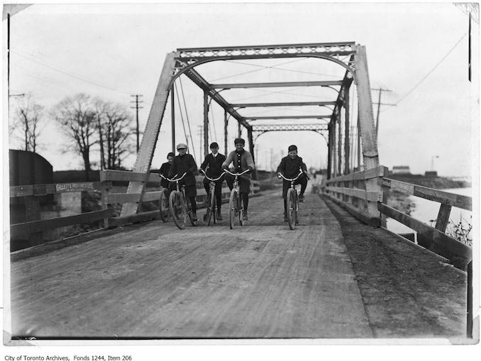 Boys cycling across Lakeshore Road bridge at Mimico. - [1907?] - Vintage Bicycle Photographs