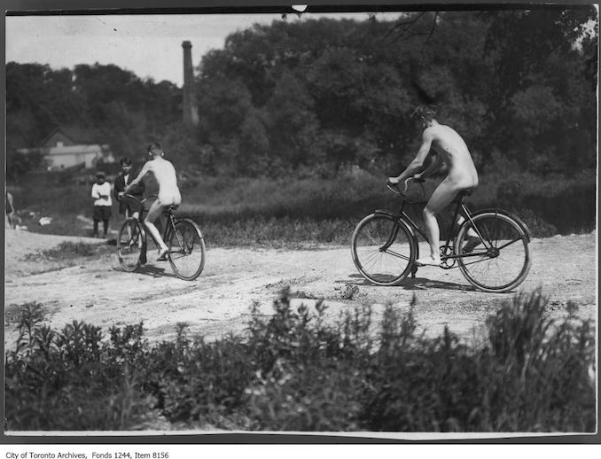 Cycling beside Don River, between Don Mills Road and Leaside . - [ca. 1912] - Vintage Bicycle Photographs