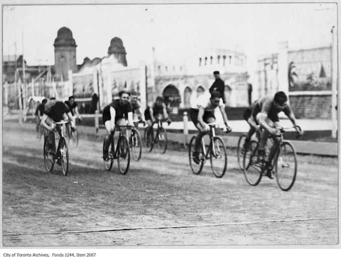 Finish of bicycle race, CNE. - September 2, 1926. The winner of the one mile race was Bill Elder, right. - Vintage Bicycle Photographs