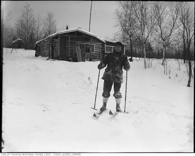 Lou Turofsky skiing near cabin in woods - 193-? - vintage skiing photographs