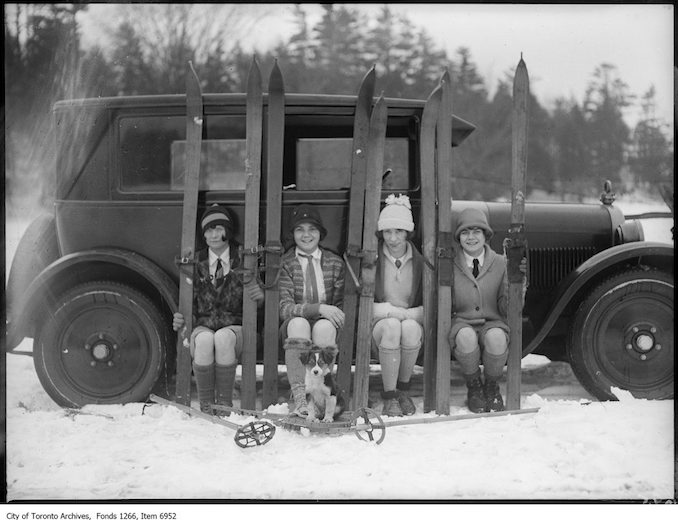 Ski-ing, four girls on running board of car. - January 17, 1926 - vintage skiing photographs