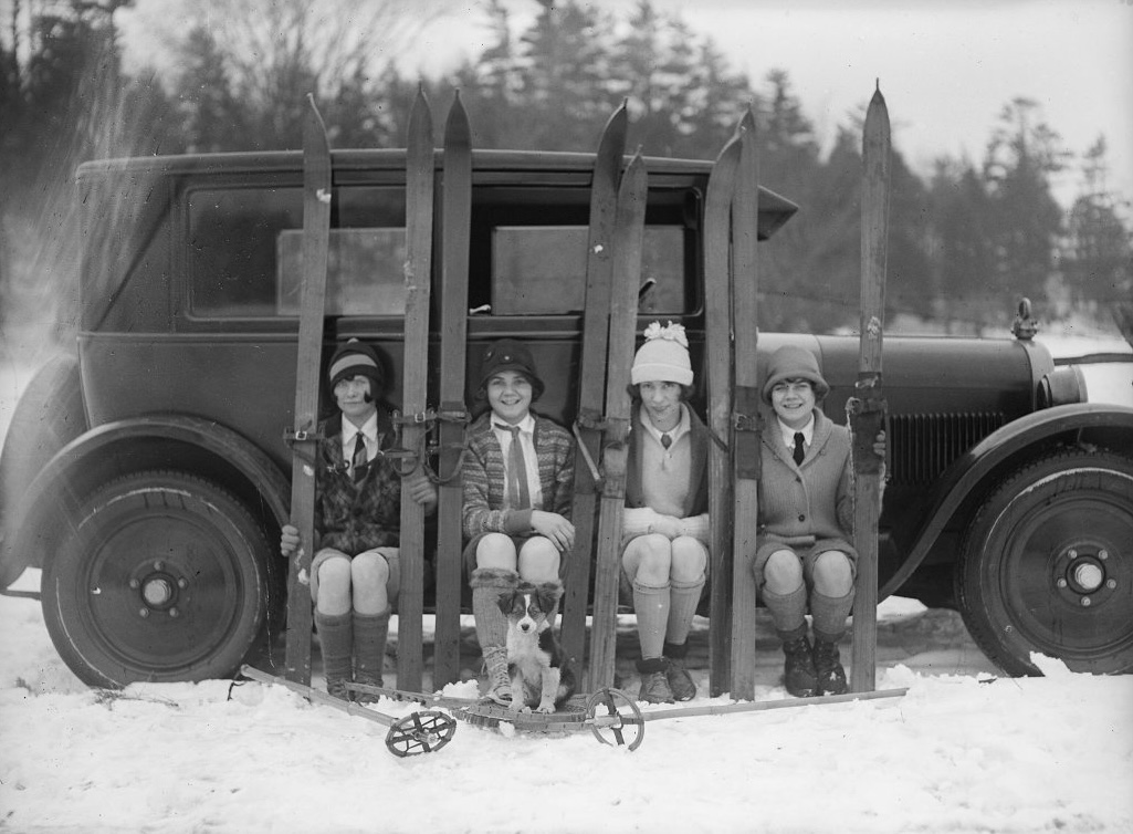 Ski-ing, four girls on running board of car. - January 17, 1926