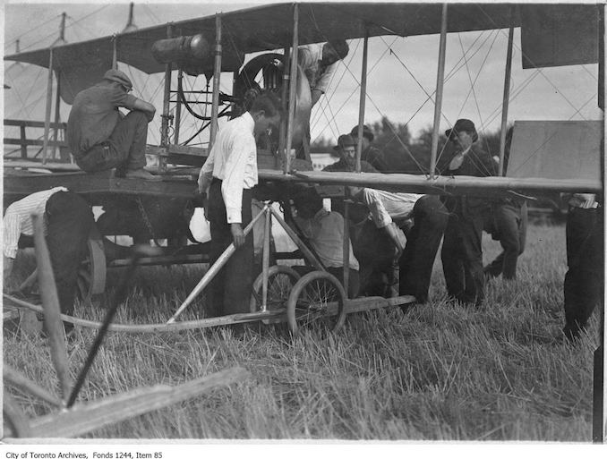 J.A.D. McCurdy's bi-plane with 7-cylinder Gnome rotary engine, and that the event is probably either the Aviation Meet held at Donlands Farm, Todmorden Mills, August 3-5, 1911, or the Aviation Meet, Hamilton, July 27-29, 1911 - Vintage Airplane Photographs