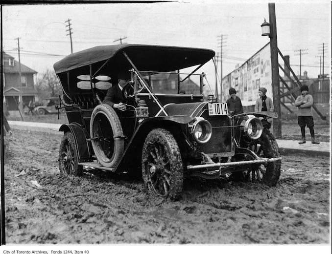 Automobile on muddy Morley Avenue. - 1912