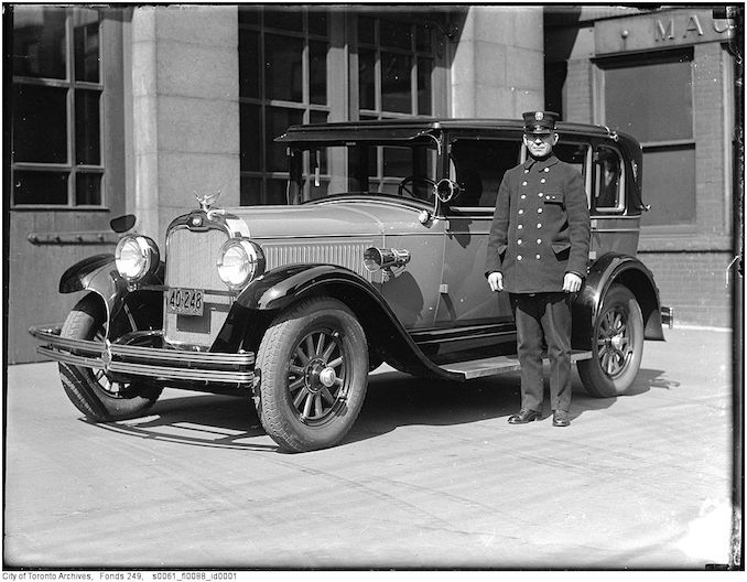 Toronto Fire Department photograph Chief William J. Russell with department car, an Oakland automobile, at Adelaide Street Firehall 1927-1940