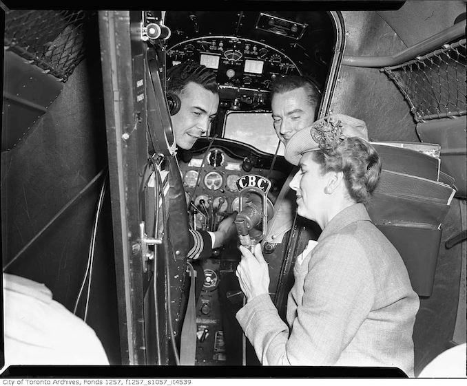 Clare Wallace and pilots inside Trans-Canada Airlines airplane