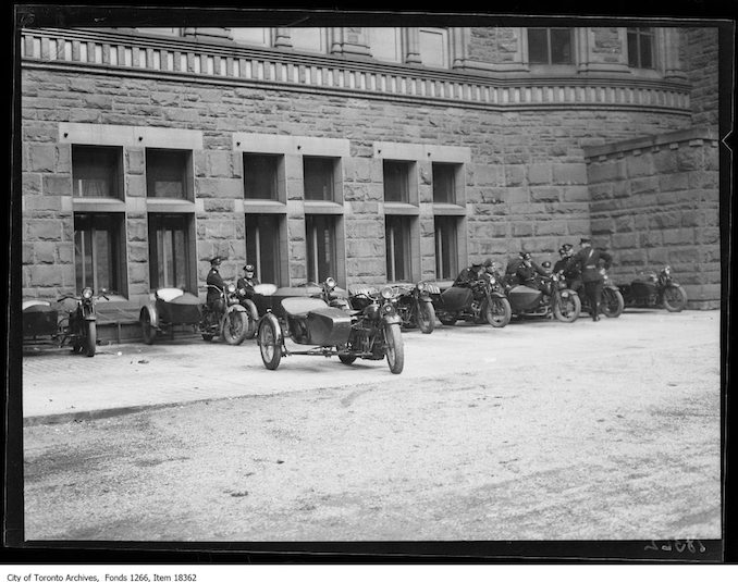 Communist meeting, motorcycle officers watching. - October 12, 1929