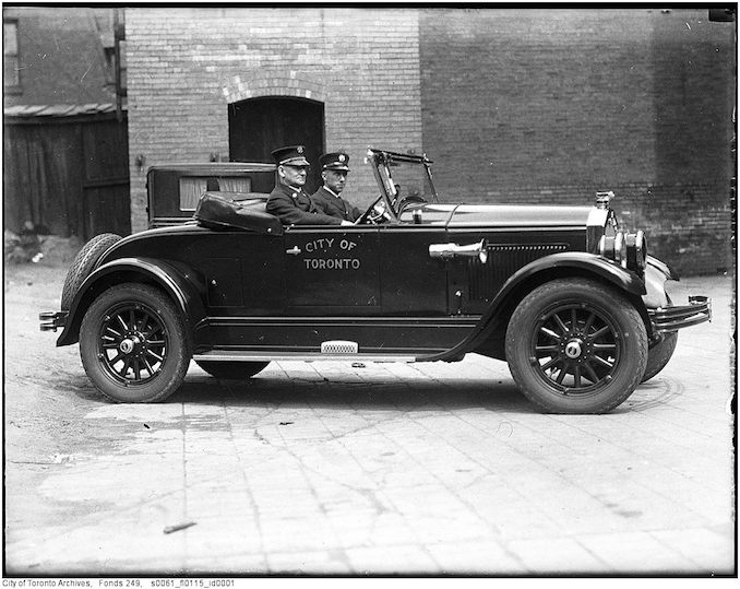 Toronto Fire Department photographs Deputy Chief Duncan McLean in City of Toronto automobile 1927-1940