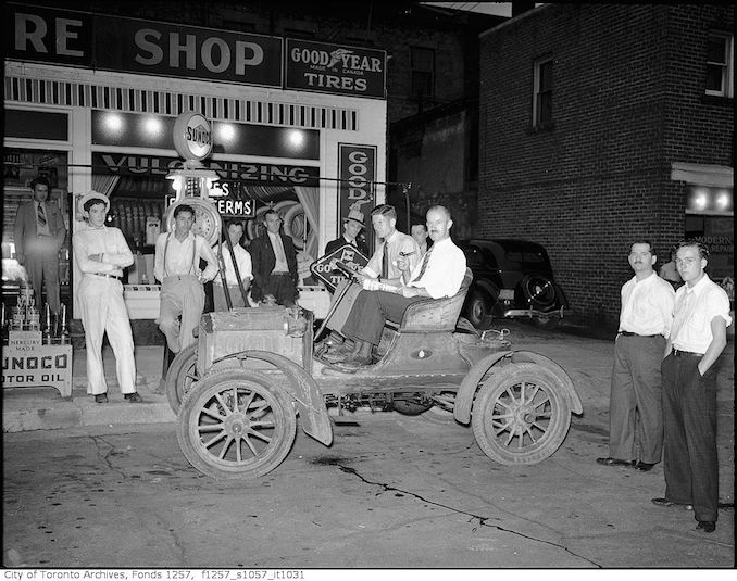 Group with old automobile 193?
