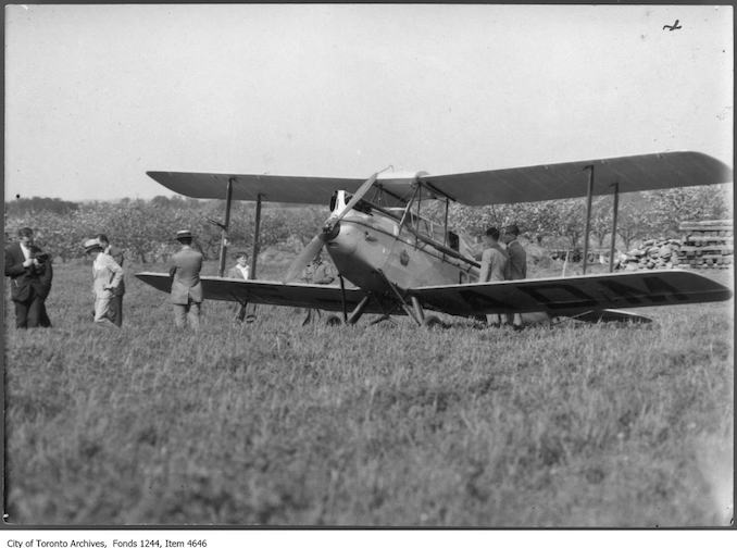 Gypsy Moth airplane in field. - 1929 - photograph probably taken at a farm in Whitby.