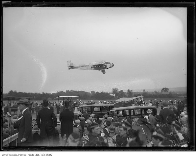 Gypsy Moth airplane in field. - 1929 - photograph probably taken at a farm in Whitby.