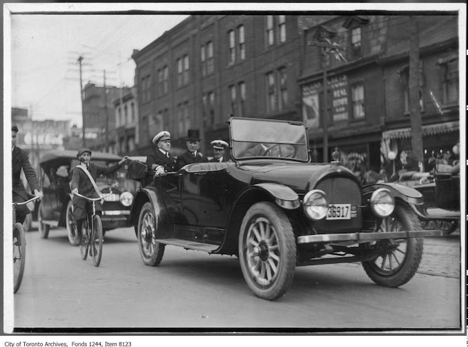 Mayor Tommy L. Church (in top hat) and naval officers. - 1917