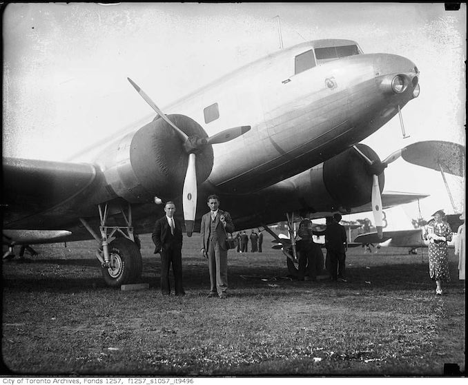 Nat Turofsky next to airplane