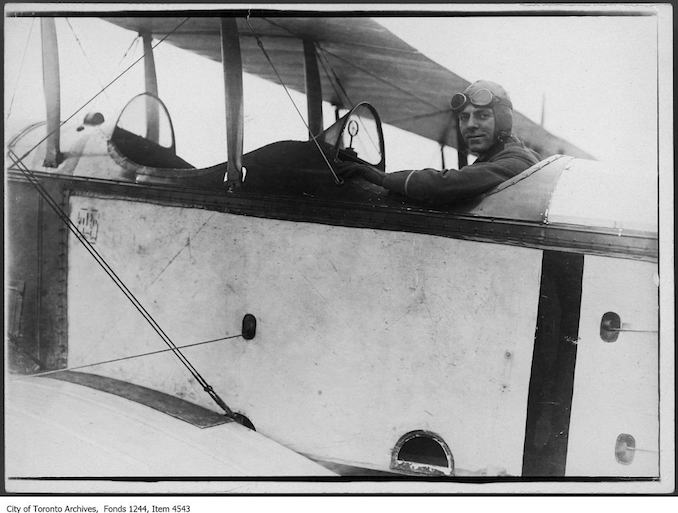 Pilot in Curtiss JN-4 airplane. - 1918