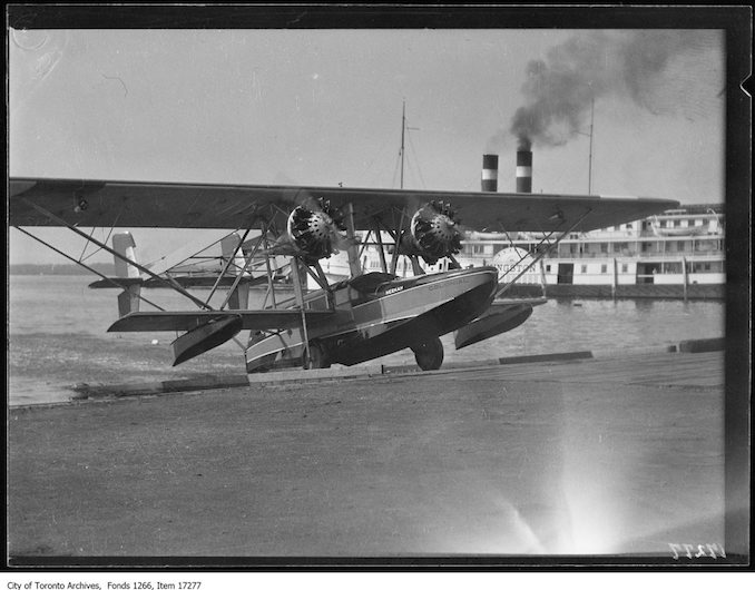 Plane christening, Neekah coming up runway. - July 15, 1929