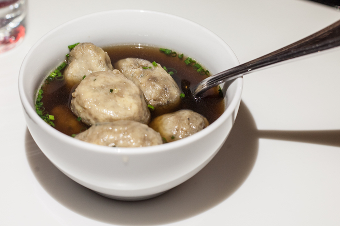 Dumplings in mushroom broth with cheese