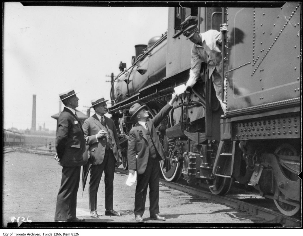 C.P.R. new Montreal train, officials & engineer, handing letter. - June 28, 1926 - vintage train photographs