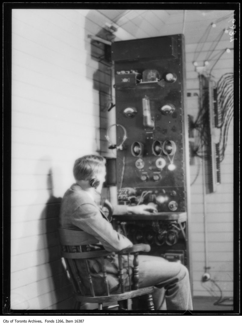 CNR train telephone, Harry Lang, assistant engineer at control panel. - May 5, 1929