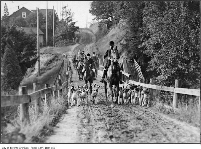 Hunters and dogs on muddy Bathurst Street north of St. Clair Avenue West. - [between 1907 and 1908]