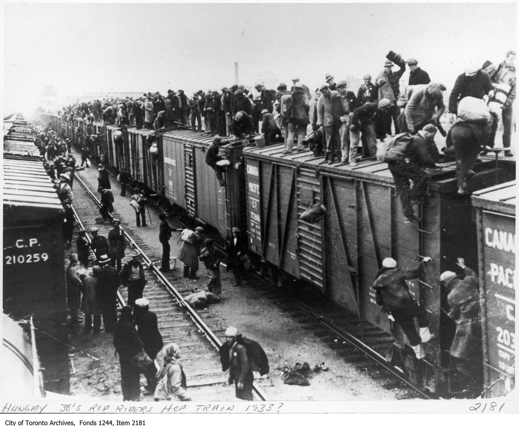 Unemployed men hop a train. - [ca. 1933]