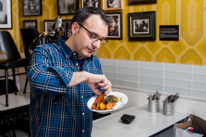 John Catucci trying a roasted heirloom carrots dish for You Gotta Eat Here