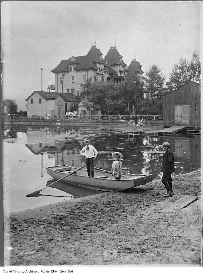 1907 - Three boys with a skiff on the beach near Hanlan's Hotel