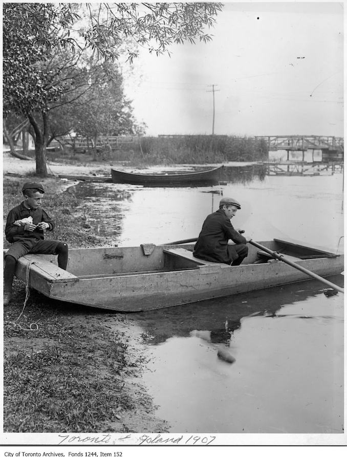 1908 - Two boys in skiff at water's edge, Toronto Island