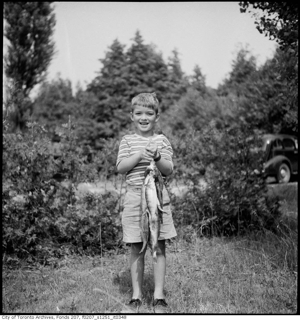 1934 - June - Boy with fishing catch - Vintage Fishing Photographs