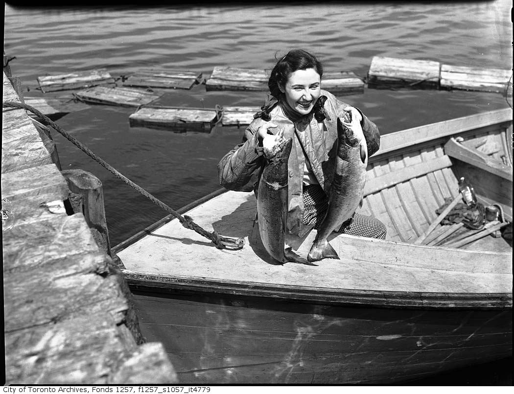 194? - Woman holding up fish - Vintage Fishing Photographs