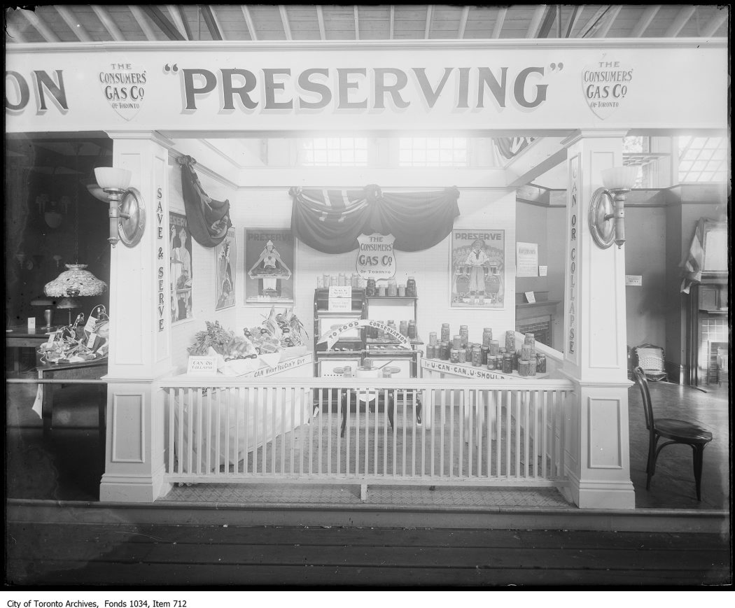 1918 - C.N.E. exhibit of food preservation using ring-top glass preserving jars "Can What You Can't Eat" and "If U Can U Should Can"