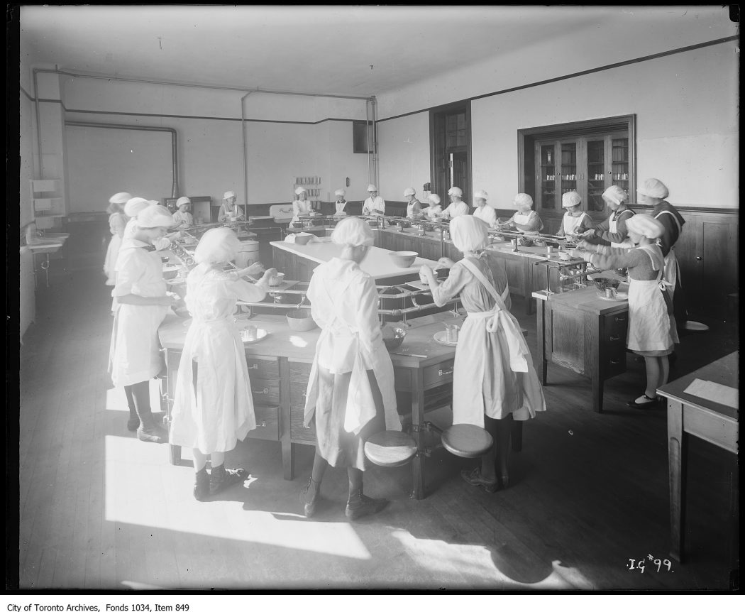 1923 - Domestic Science class at Earl Grey School - students using specially designed gas burners to learn cooking skills