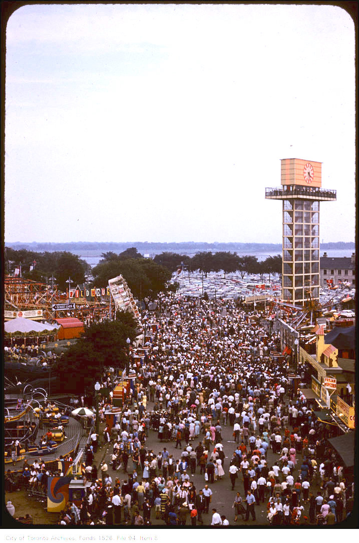 1958 - Slight overhead view of crowds on CNE grounds and new Shell oil tower