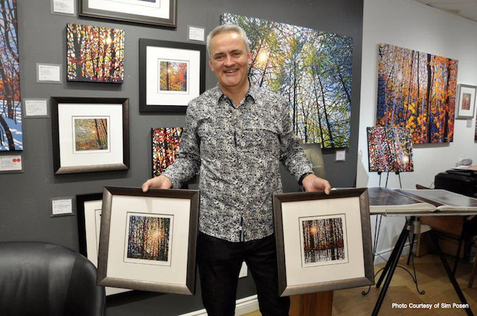 Me at Liss Gallery This is a photo of me with a number of our framed paper prints - Tim Packer