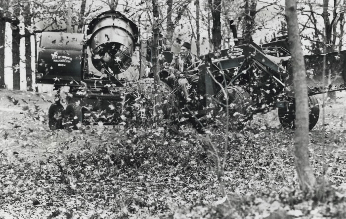 1977 - Blowing up a storm of leaves; If you ever wonder who and how they rake up leaves in High Park just follow Jim Warner and Jim Forsythe of city's parks and recreation department.