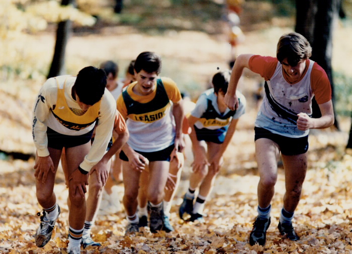 1985 - Athletes get a hard lesson in running; A near perfect autumn day couldn't help ease the pain for these runners as they neared the to of a hill at Earl Bales Park