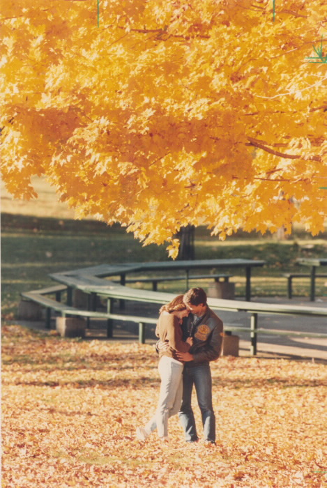 1985 - It was great while it lasted but the weatherman says our golden autumn is about to be blown away by cold winds as Averill Clarke and Jim Nikiforos linger in the glory of High Park.