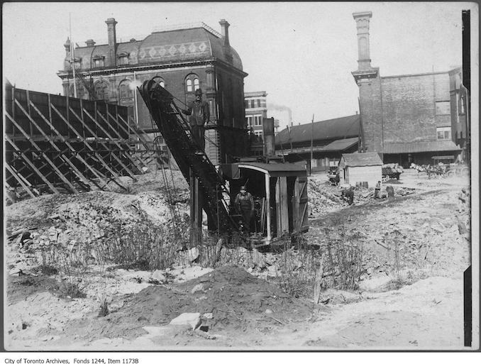 1908 - Excavating in the Great Fire ruins for new Customs House, Front Street and Yonge Street.