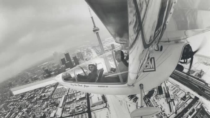 1985 - A wing-mounted camera captures this view of the Toronto skyline with pilot Larry Newman 37 left and Star photographer Mike Slaughter