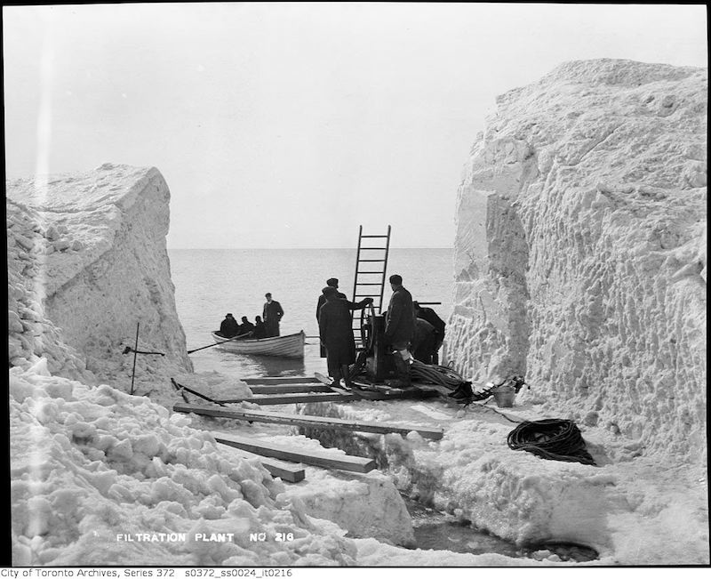 1911 - Cleared path through snow bank to open lake at Island Filtration Plant construction site