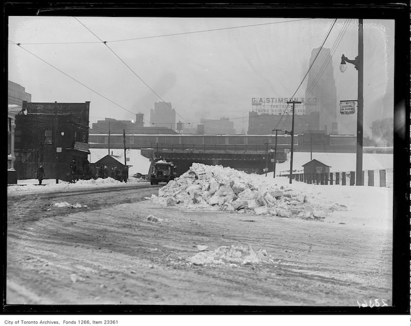 1931 - Snow clearing, pile of snow, Bay Street, subway background