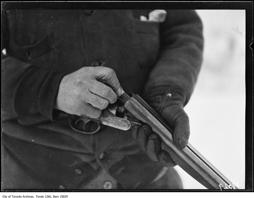 1930 - January 18 - Clarkson rabbit hunt, hunter loading gun