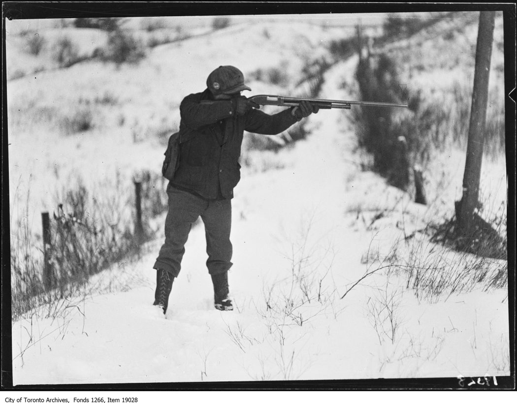 1930 - January 18th - Clarkson rabbit hunt, hunter pointing gun