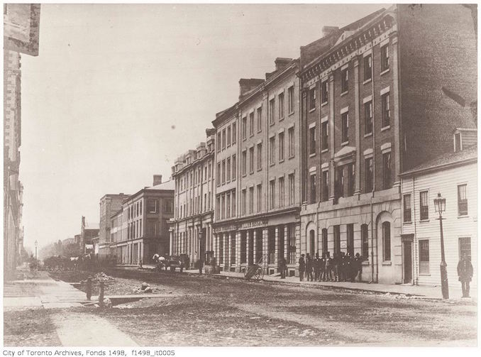 1856 - Wellington Street East north-side between Church and Yonge streets, showing the Wellington Hotel