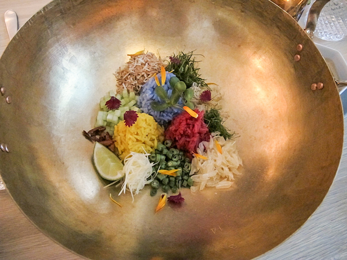 Pomelo Rice Bowl. A complex rice dish containing naturally coloured jasmine rice. Flavours ranging from lemongrass, Thai spice, and a fresh acidity from the individually picked pomelo grains - kiin Toronto