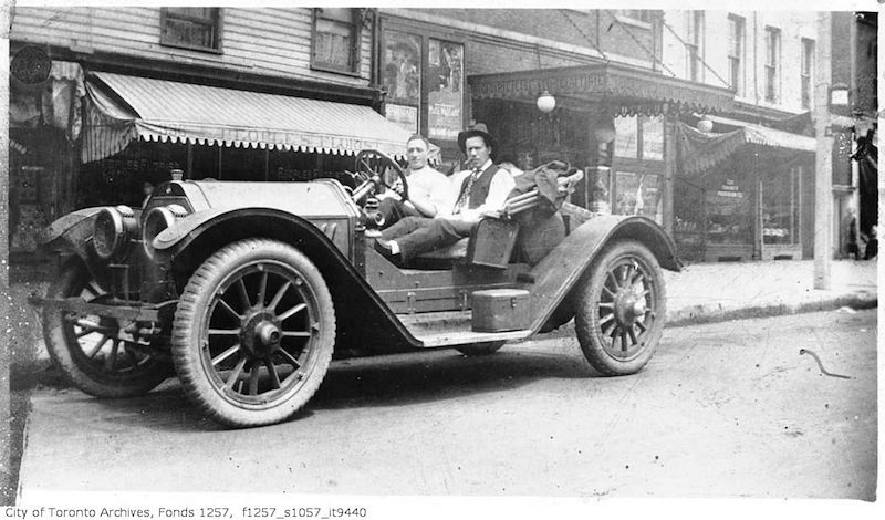 1912 - Lou Turofsky, in his first car, near the original studio, 322 1:2 Queen Street West