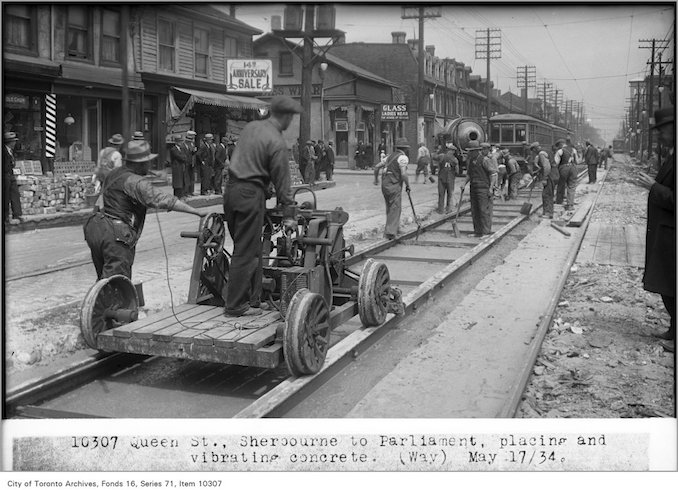 1934 - May 17 - Queen St, Sherbourne to Parliament, placing and vibrating concrete,