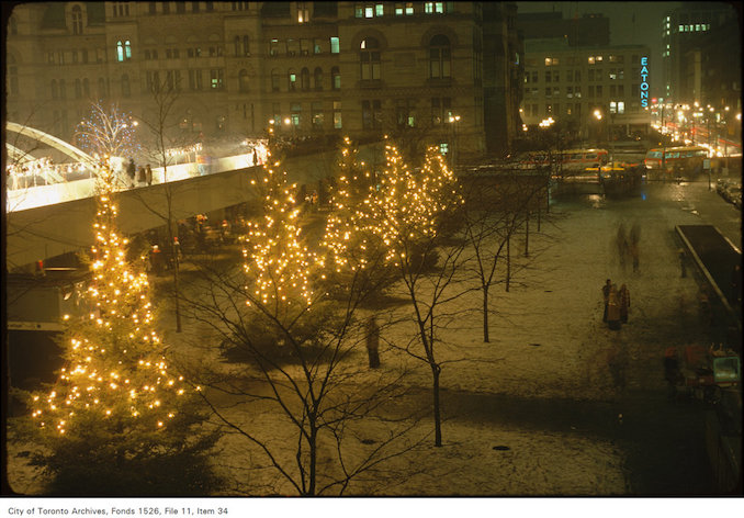 1974 - Dec 31 - View of holiday decorations at Nathan Phillips Square and Queen Street West