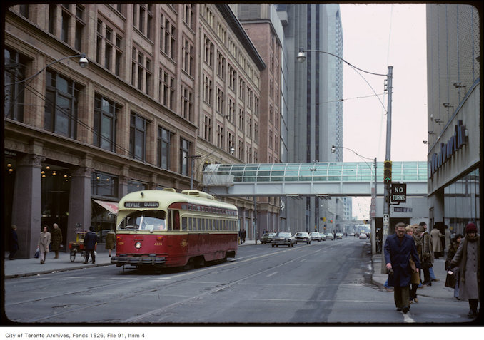 1979 - March 1st - - View of completed pedestrian bridge to Simpson's and old streetcar on Queen Street West