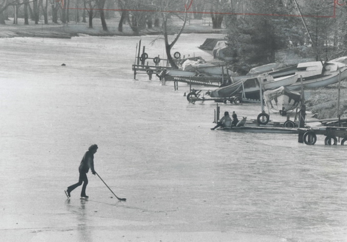 1973 - Metro's biggest hockey rink is at Michael Coyle's disposal as he skates by himself with a hockey stick and puck in the middle of the lagoon off Algonquin Island